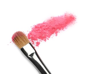 Photo of Makeup brush with pink eye shadow isolated on white, above view