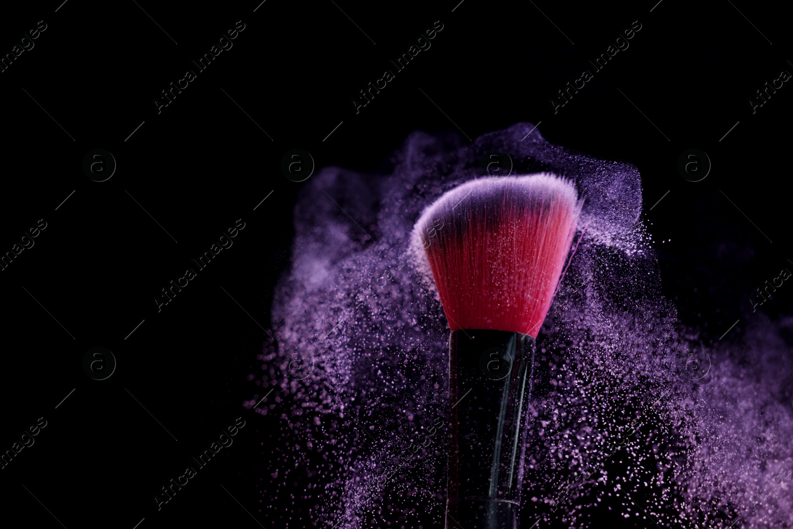 Makeup brush with purple eye shadow on black background, closeup. Space for text Photo of Makeup brush with purple eye shadow on black background, closeup. Space for text