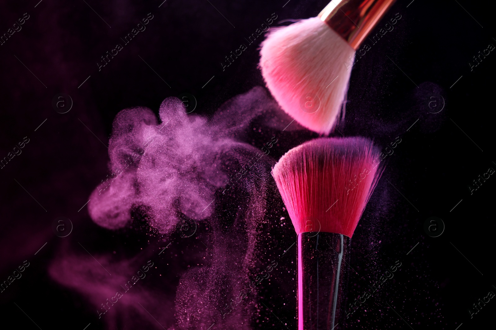 Makeup brushes with pink eye shadow on black background, closeup. Space for text Photo of Makeup brushes with pink eye shadow on black background, closeup. Space for text