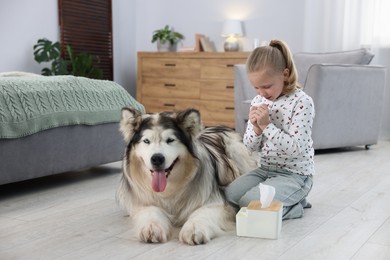 Photo of Girl suffering from allergy with her dog at home