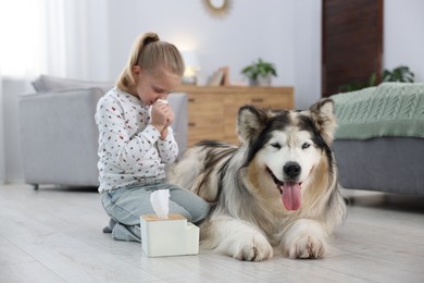 Photo of Girl suffering from allergy with her dog at home