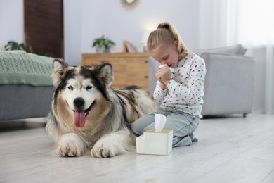 Photo of Girl suffering from allergy with her dog at home