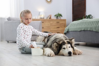 Photo of Girl suffering from allergy with her dog at home