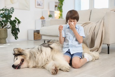 Photo of Boy suffering from allergy with her dog at home