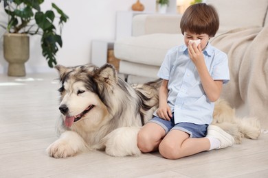 Photo of Boy suffering from allergy with her dog at home
