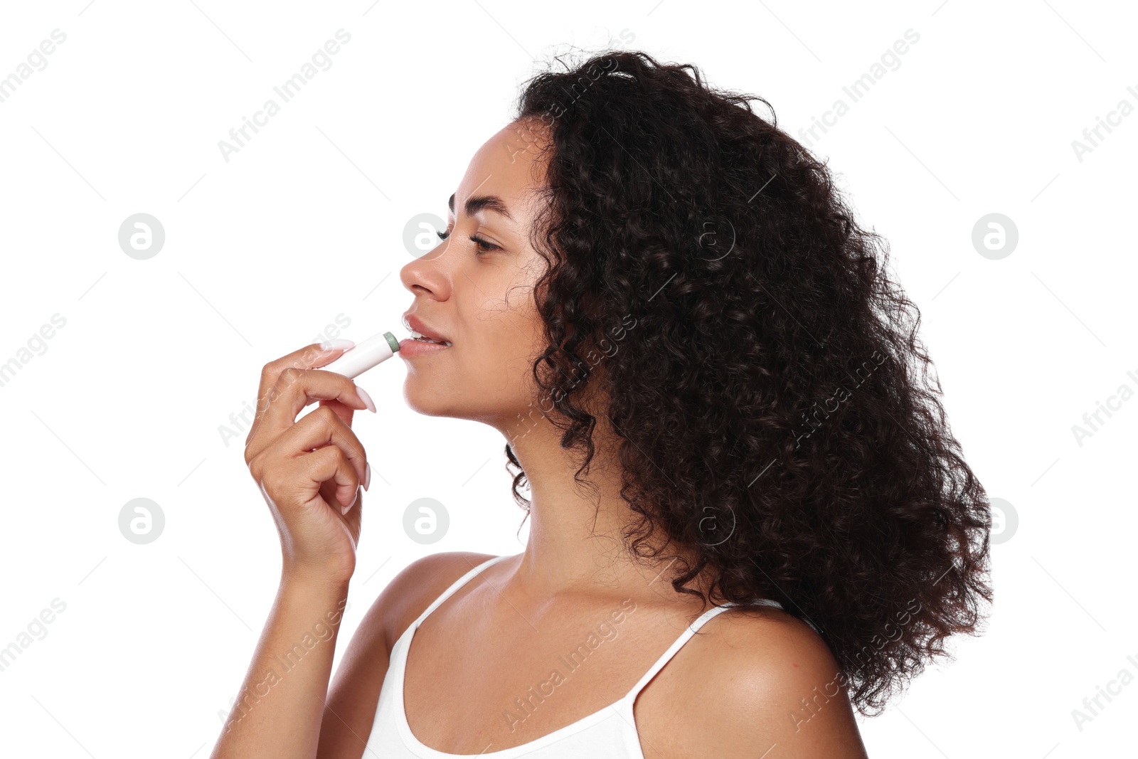 Beautiful woman applying lip balm onto her lips on white background Photo of Beautiful woman applying lip balm onto her lips on white background