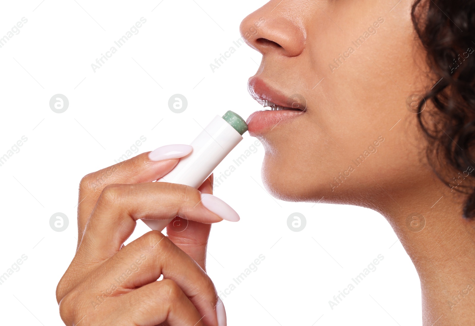 Woman applying lip balm onto her lips on white background, closeup Photo of Woman applying lip balm onto her lips on white background, closeup