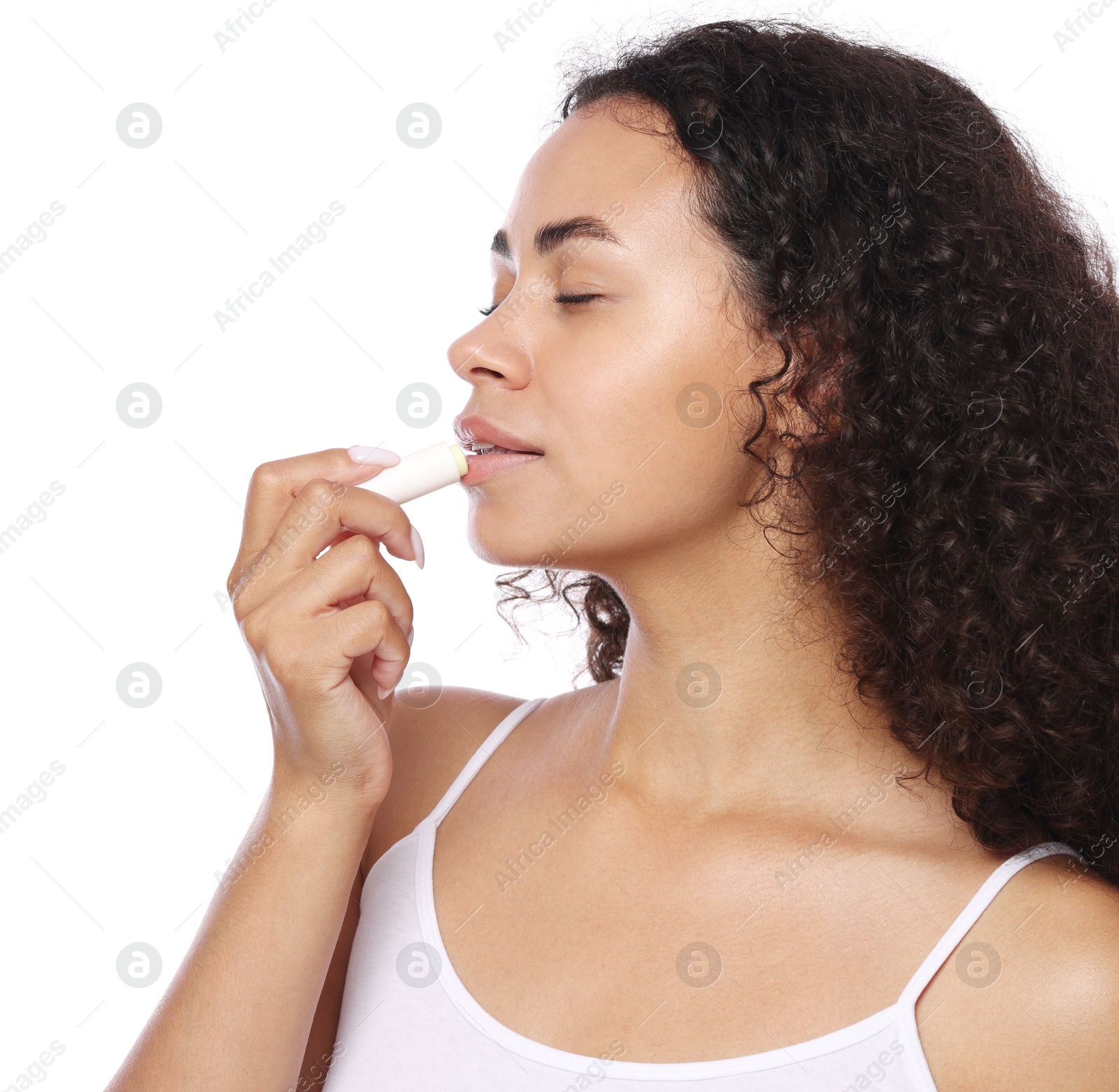 Beautiful woman applying lip balm onto her lips on white background Photo of Beautiful woman applying lip balm onto her lips on white background
