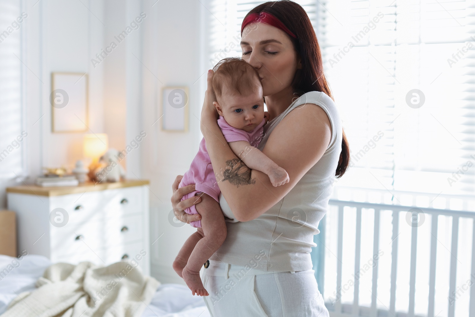 Mother with her newborn baby at home Photo of Mother with her newborn baby at home