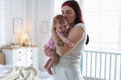 Photo of Mother with her newborn baby at home