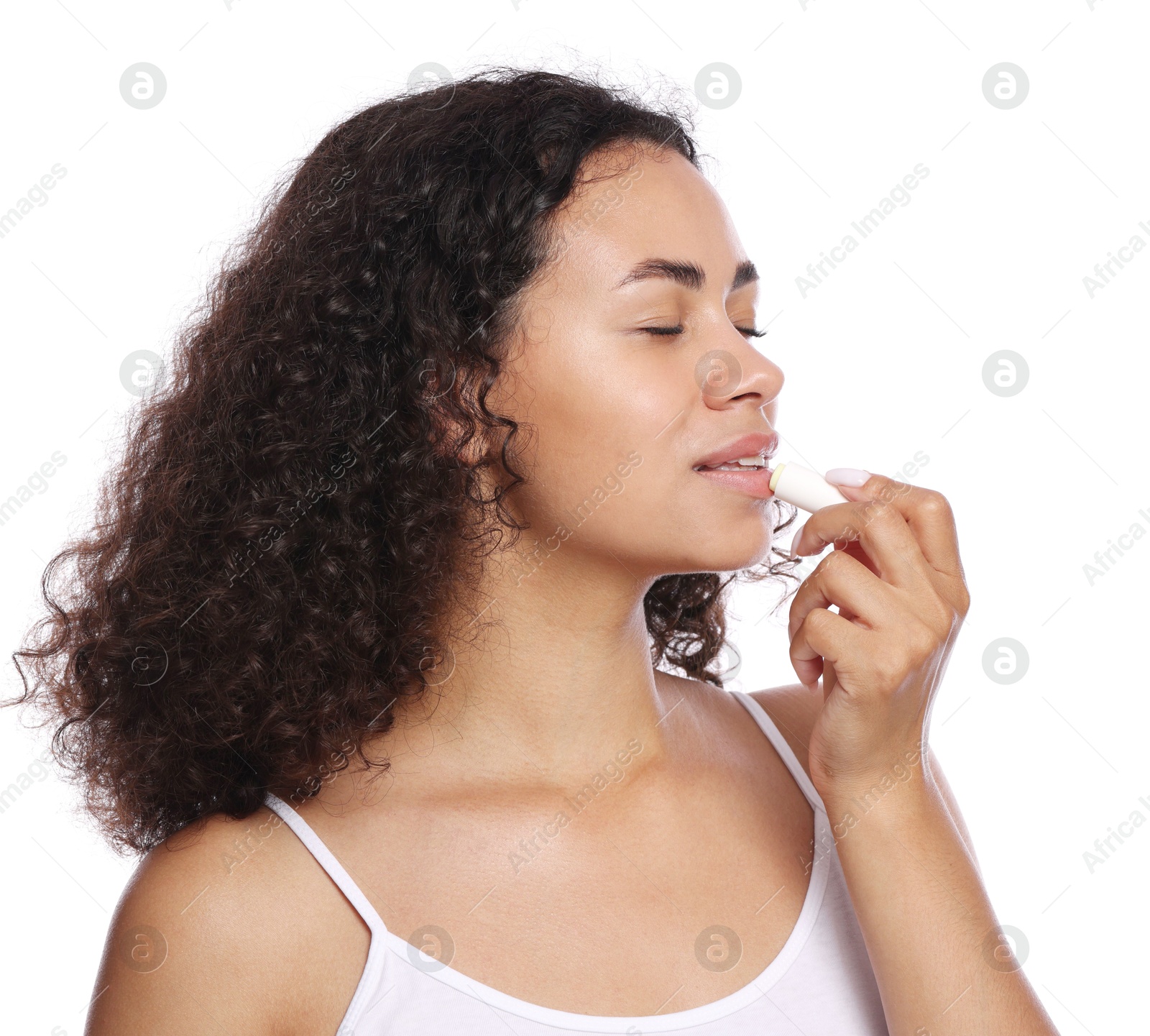 Beautiful woman applying lip balm onto her lips on white background Photo of Beautiful woman applying lip balm onto her lips on white background