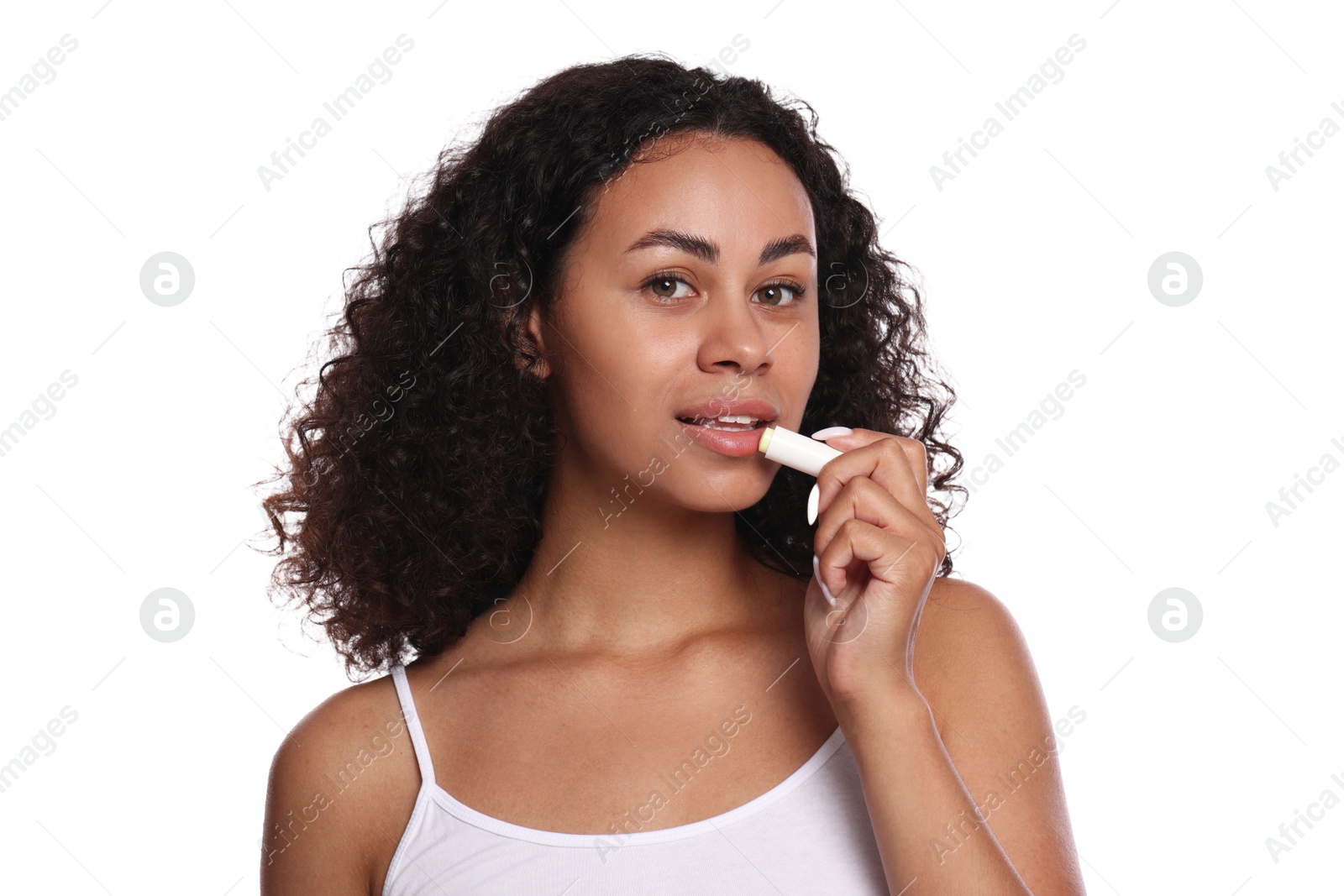 Beautiful woman applying lip balm onto her lips on white background Photo of Beautiful woman applying lip balm onto her lips on white background