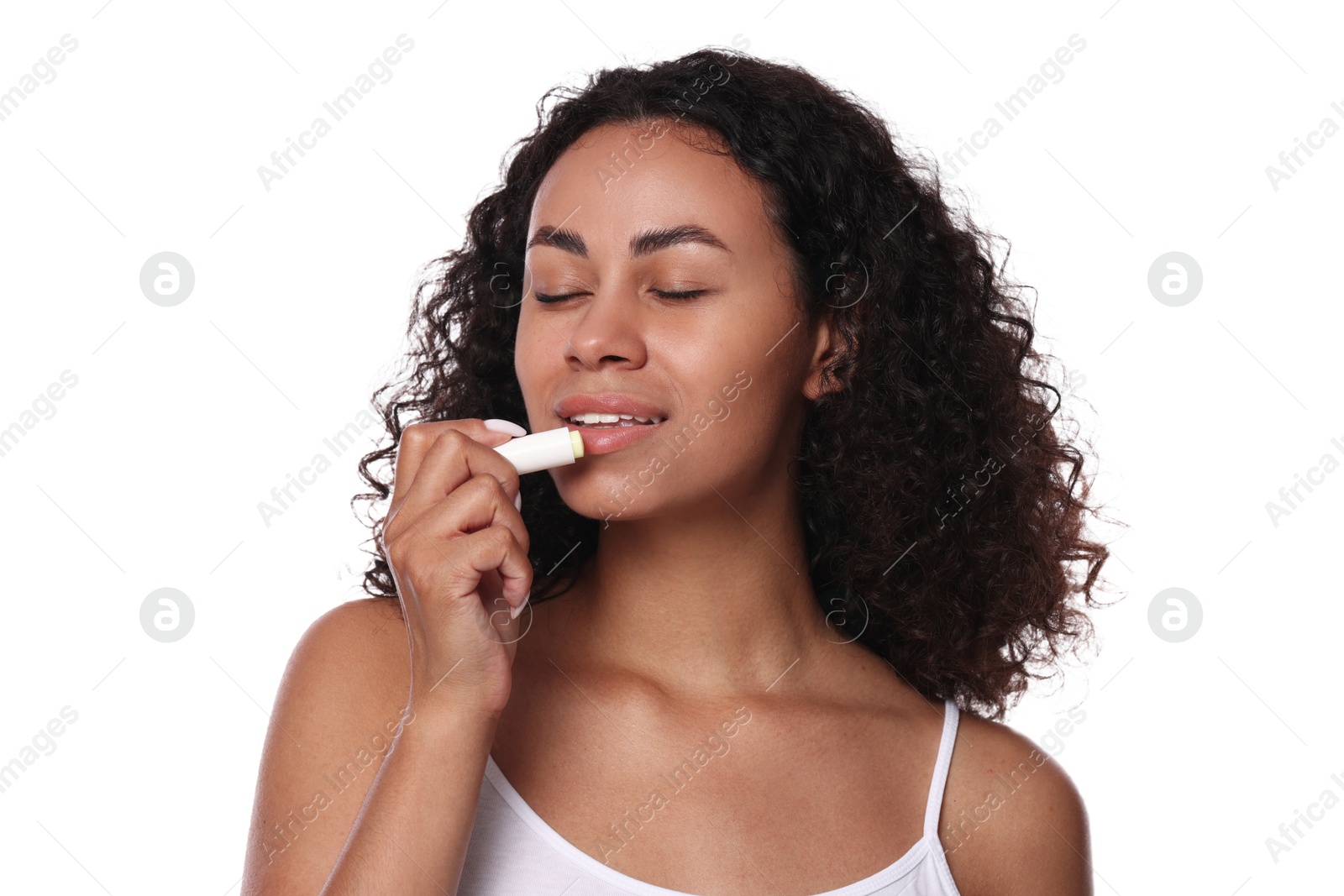 Beautiful woman applying lip balm onto her lips on white background Photo of Beautiful woman applying lip balm onto her lips on white background