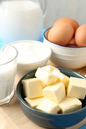 Photo of Different dairy products and eggs on table, closeup