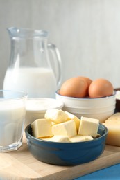 Photo of Different dairy products and eggs on table, closeup