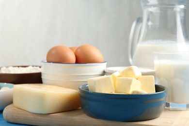 Photo of Different dairy products and eggs on table, closeup
