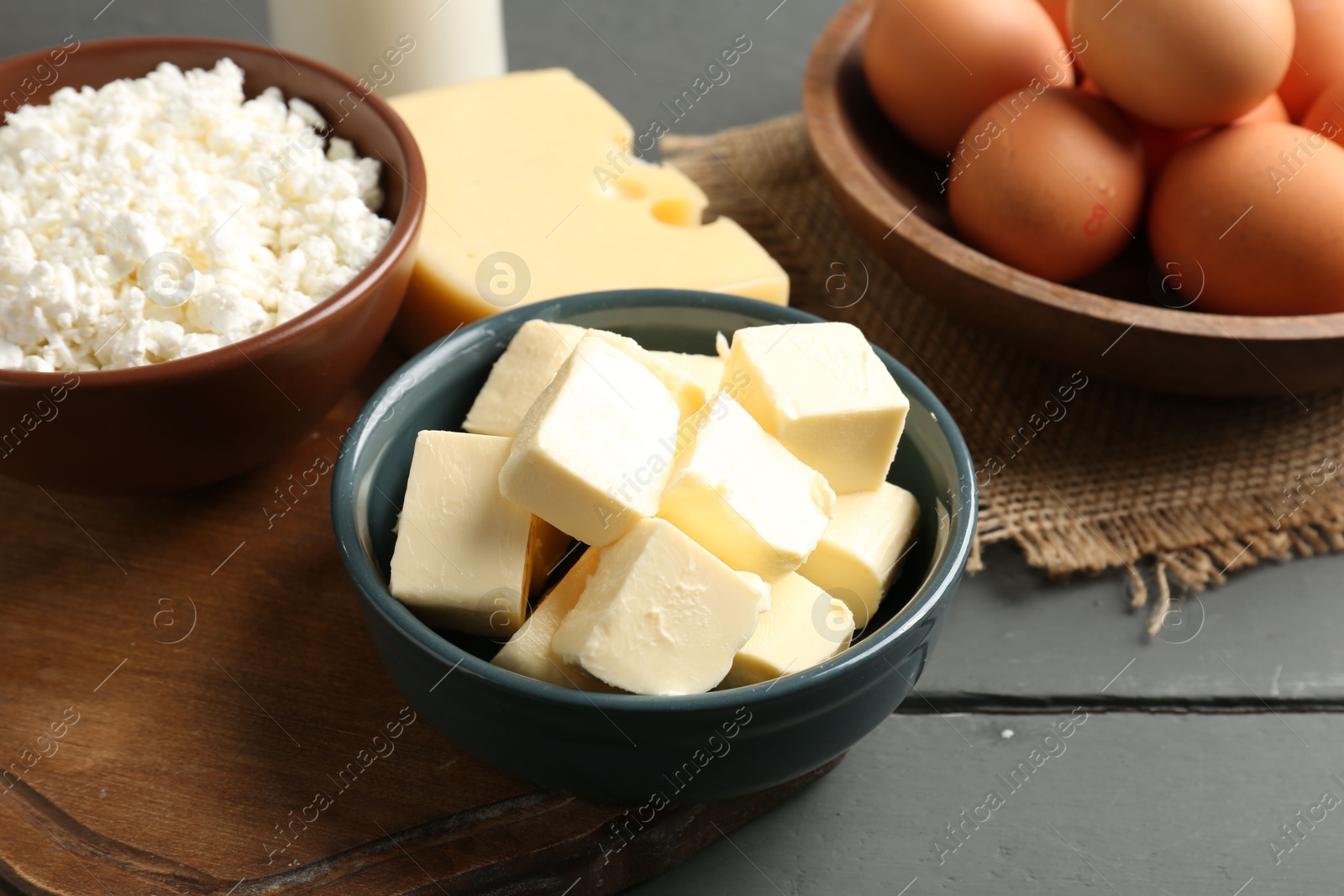 Different dairy products and eggs on grey wooden table, closeup Photo of Different dairy products and eggs on grey wooden table, closeup