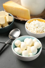 Photo of Different dairy products on grey wooden table, above view