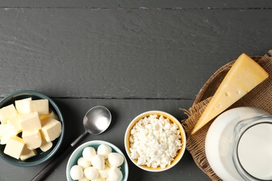 Photo of Different dairy products on grey wooden table, flat lay. Space for text