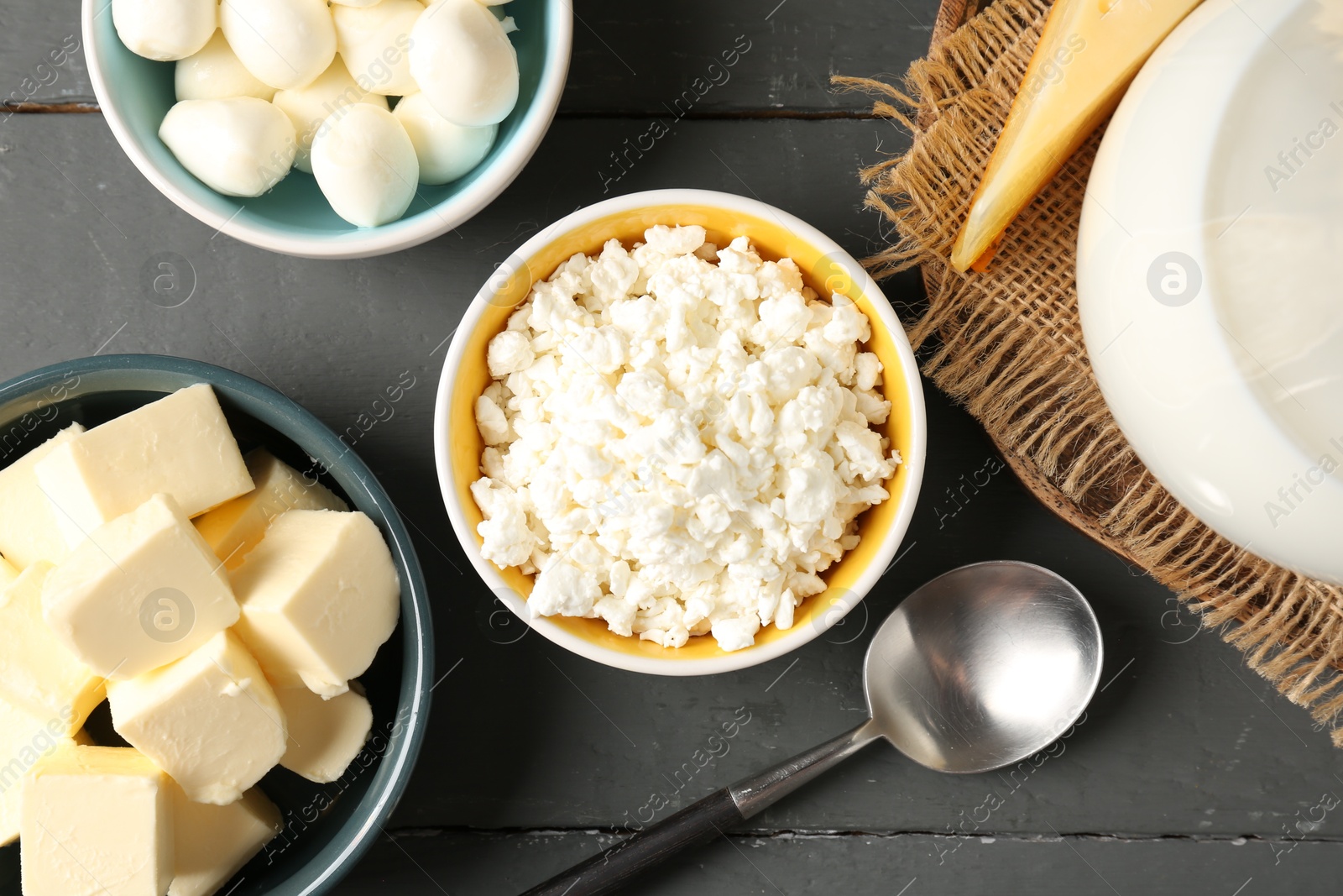 Different dairy products on grey wooden table, flat lay Photo of Different dairy products on grey wooden table, flat lay