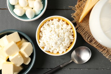Photo of Different dairy products on grey wooden table, flat lay