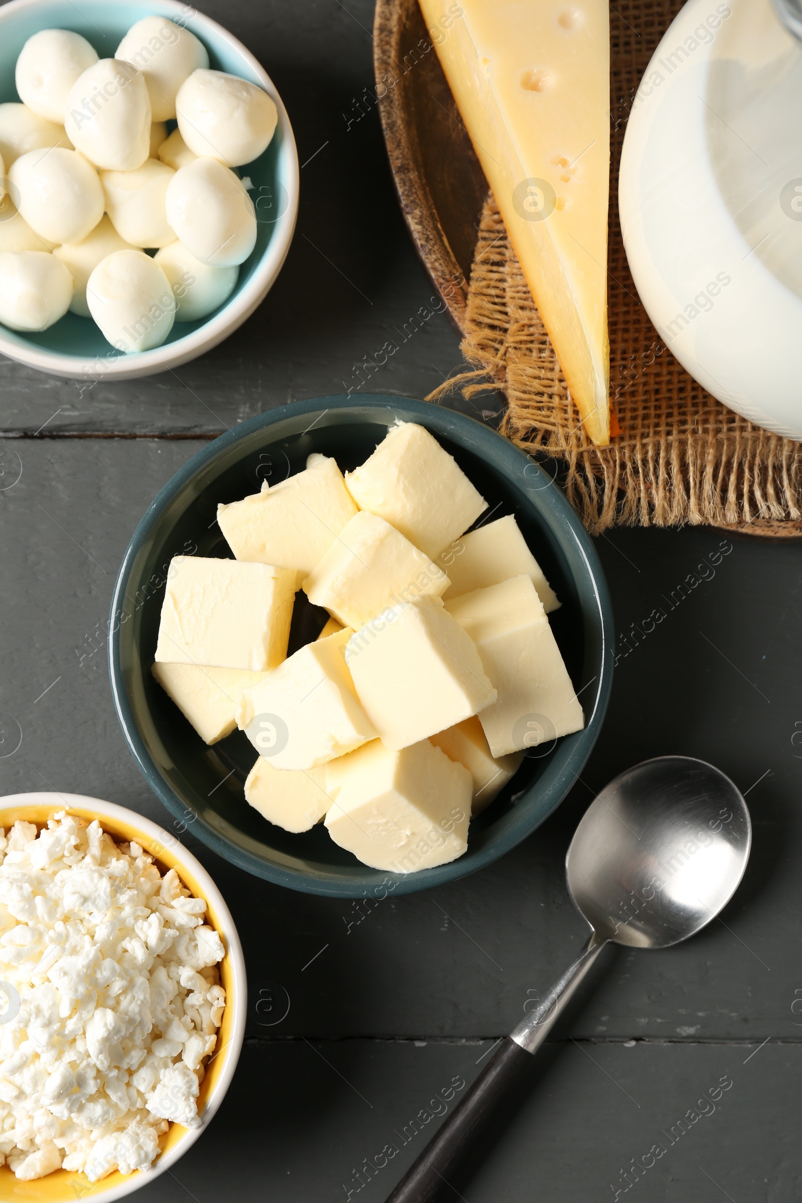 Different dairy products on grey wooden table, flat lay Photo of Different dairy products on grey wooden table, flat lay