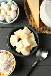 Photo of Different dairy products on grey wooden table, flat lay