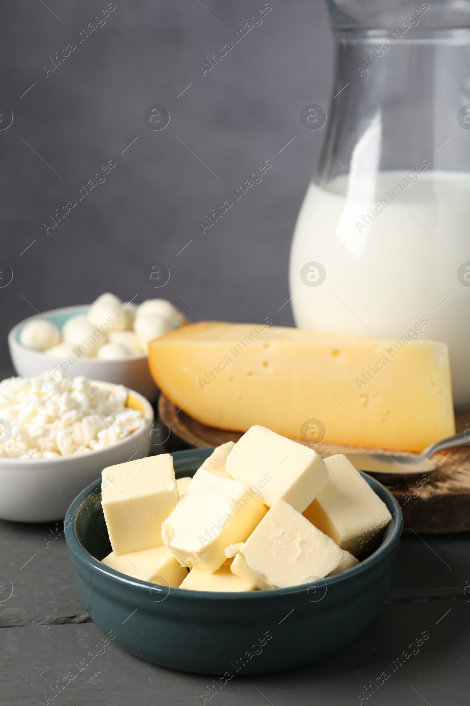 Different dairy products on grey wooden table, closeup Photo of Different dairy products on grey wooden table, closeup