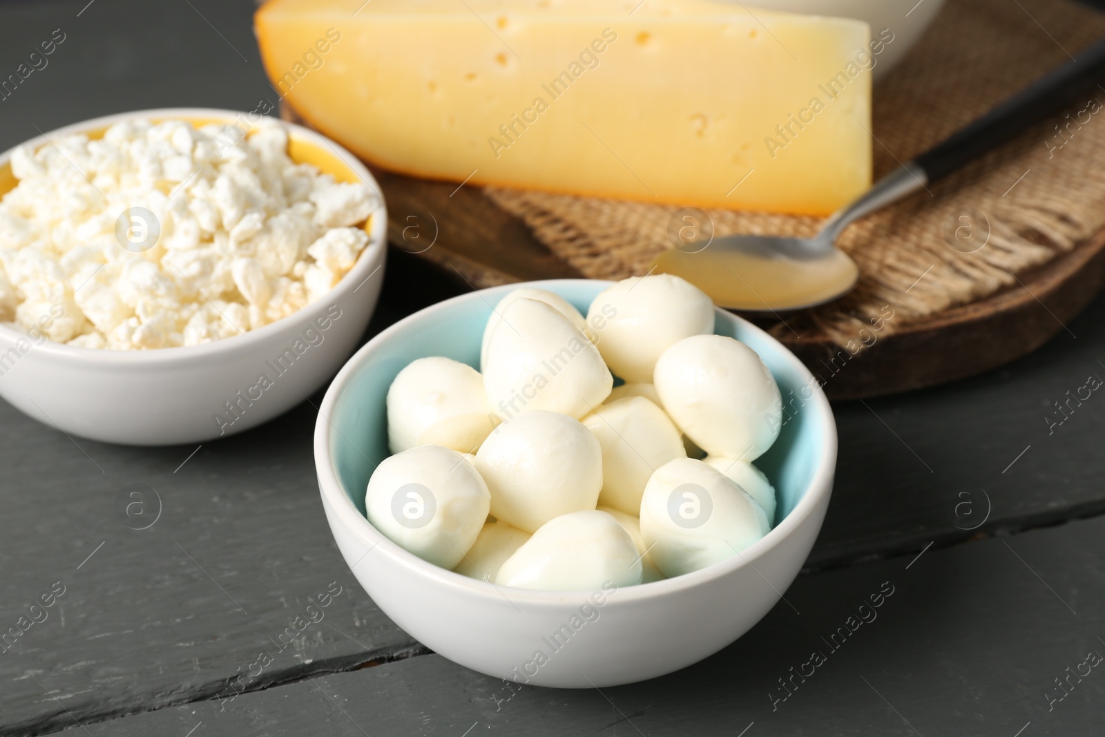 Different dairy products on grey wooden table, closeup Photo of Different dairy products on grey wooden table, closeup