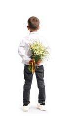 Photo of Little boy hiding bouquet of beautiful chamomile flowers on white background, back view