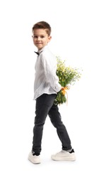 Photo of Little boy hiding bouquet of beautiful chamomile flowers behind back on white background