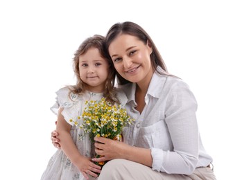 Photo of Mother and her little daughter with bouquet of beautiful chamomile flowers on white background