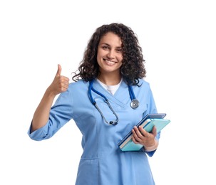 Photo of Medical student with books showing thumbs up on white background