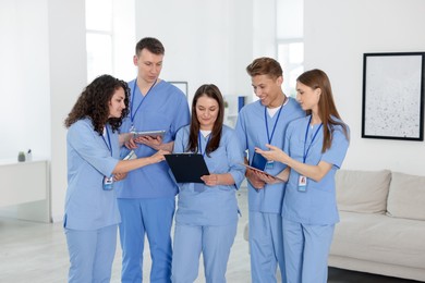 Photo of Group of medical students in uniforms indoors