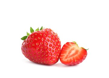 Photo of Fresh whole and cut strawberries isolated on white