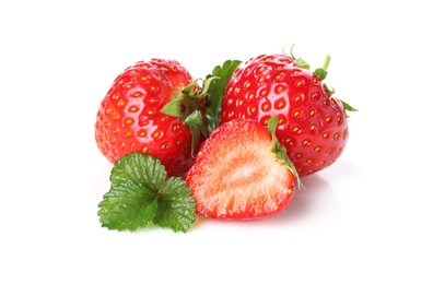 Photo of Fresh whole, cut strawberries and leaves isolated on white