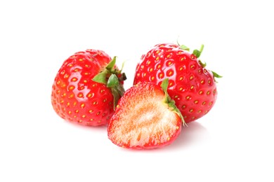 Photo of Fresh whole, cut strawberries and leaves isolated on white