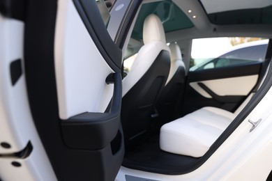Photo of Modern car interior with seats, view from outside
