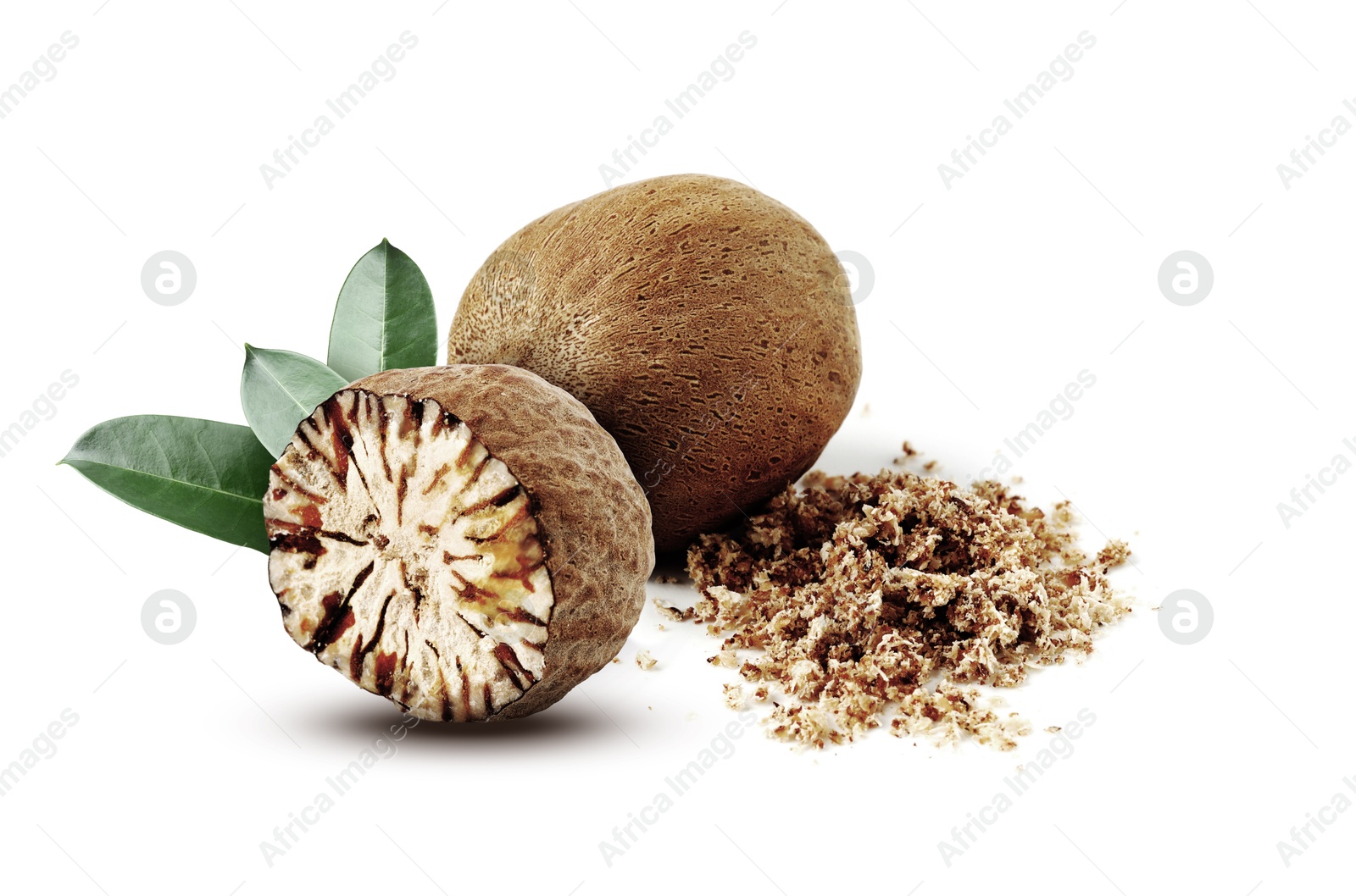 Nutmeg seeds with green leaves on white background. Aromatic spice Image of Nutmeg seeds with green leaves on white background. Aromatic spice