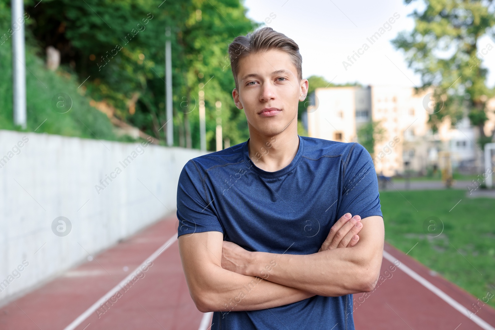 Portrait of happy sportsman at stadium. Healthy lifestyle Photo of Portrait of happy sportsman at stadium. Healthy lifestyle