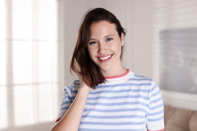 Photo of Portrait of smiling teenage girl at home