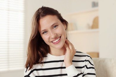 Photo of Portrait of smiling teenage girl at home