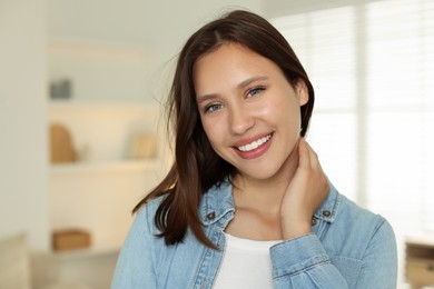 Photo of Portrait of smiling teenage girl at home