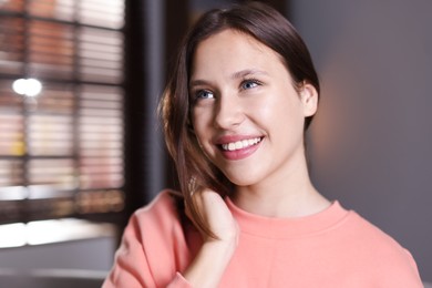 Photo of Portrait of smiling teenage girl at home