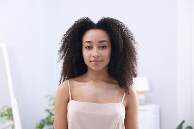Photo of Beautiful Brazilian woman with healthy skin indoors