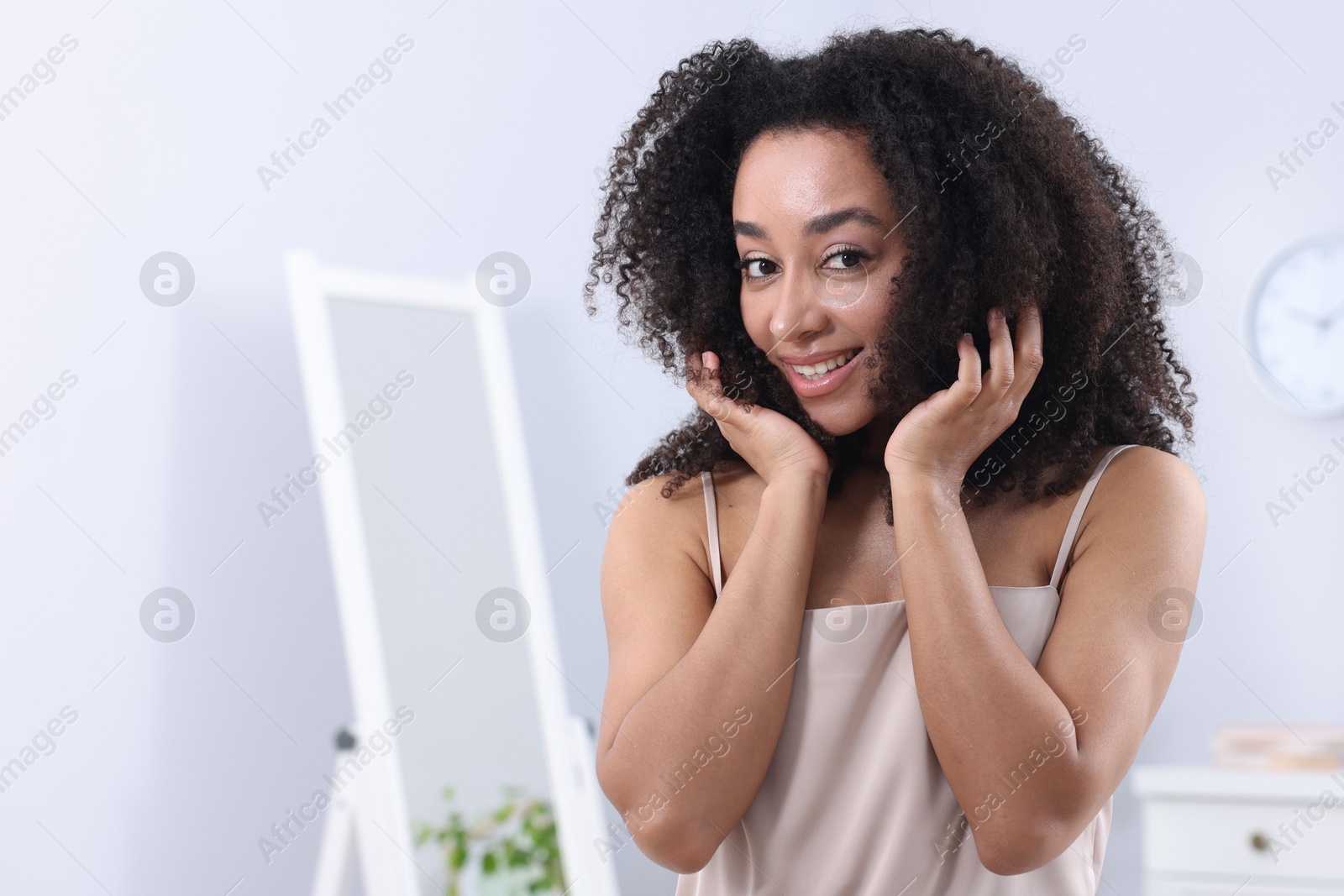 Beautiful Brazilian woman with healthy skin indoors. Space for text Photo of Beautiful Brazilian woman with healthy skin indoors. Space for text