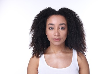 Photo of Beautiful Brazilian woman with healthy skin on white background
