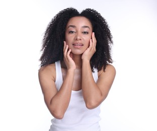 Photo of Beautiful Brazilian woman with healthy skin on white background