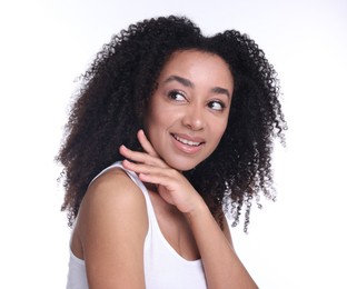 Photo of Beautiful Brazilian woman with healthy skin on white background