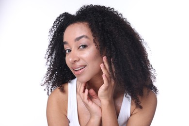 Photo of Beautiful Brazilian woman with healthy skin on white background